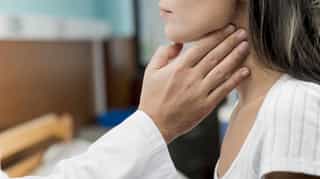 Person with throat discomfort.