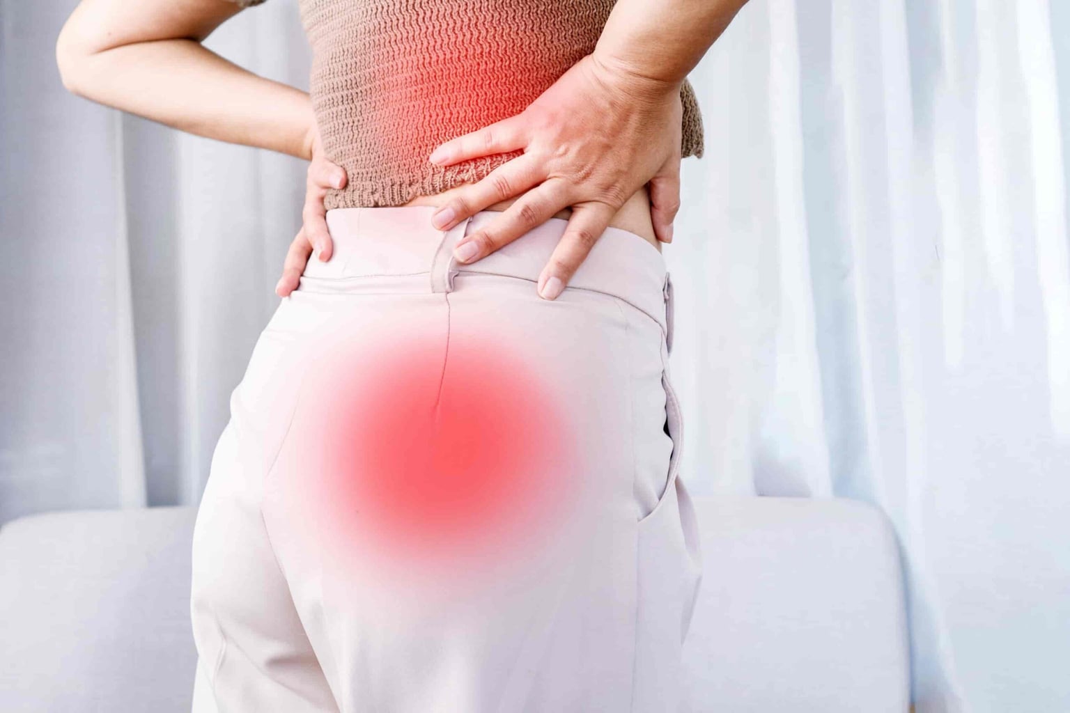 A person stretching to relieve sciatic nerve pain.